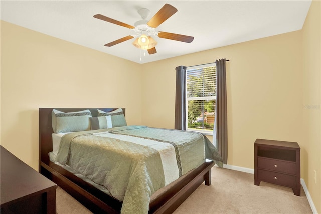 bedroom featuring light carpet and ceiling fan