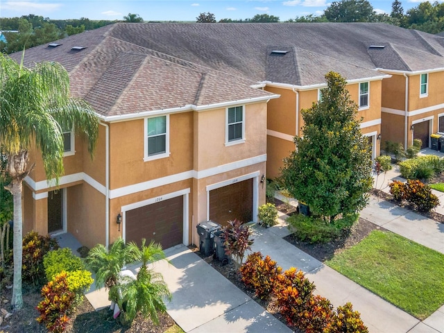 townhome / multi-family property featuring a garage