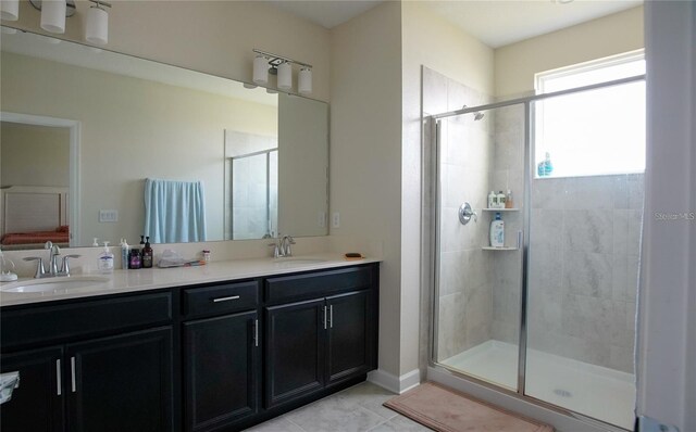 bathroom with an enclosed shower, tile patterned flooring, and dual bowl vanity