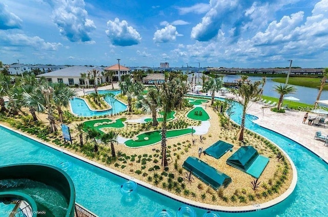 view of swimming pool with a water view