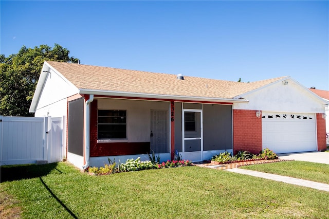 single story home with a front lawn, a porch, and a garage