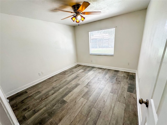 empty room featuring ceiling fan and wood-type flooring