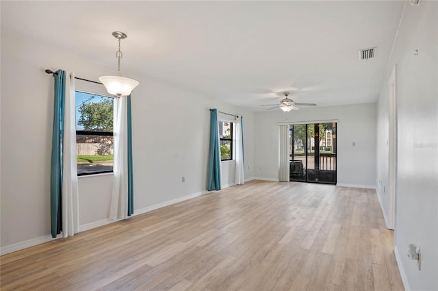 unfurnished room with light hardwood / wood-style floors and ceiling fan