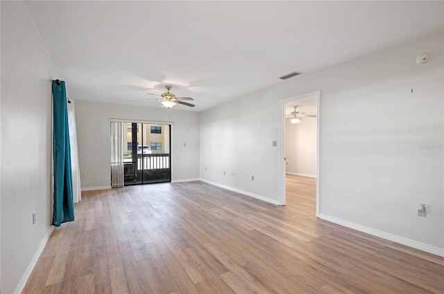 spare room with light hardwood / wood-style floors and ceiling fan