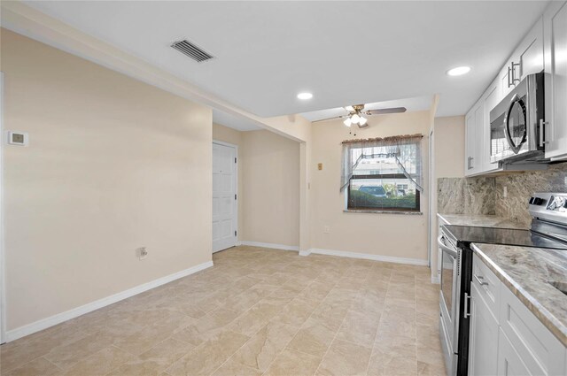 kitchen with white cabinets, stainless steel appliances, backsplash, light tile patterned floors, and ceiling fan