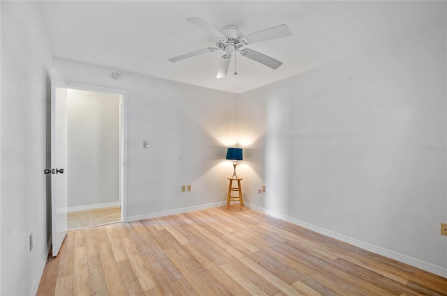 unfurnished room featuring ceiling fan and light wood-type flooring