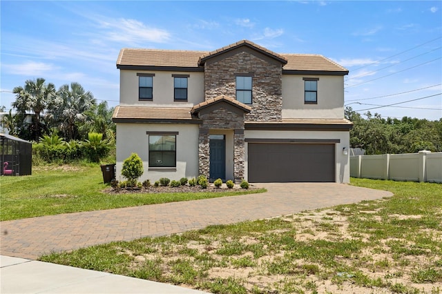 view of front property with a garage and a front yard