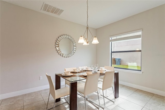 unfurnished dining area with light tile patterned floors and an inviting chandelier