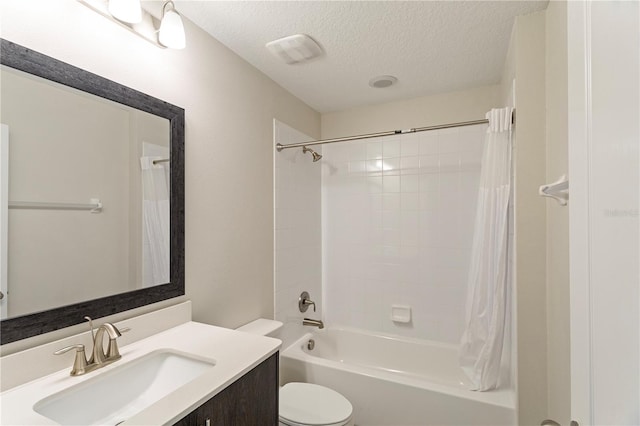 full bathroom featuring a textured ceiling, toilet, shower / tub combo, and vanity