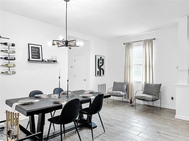 dining space with an inviting chandelier