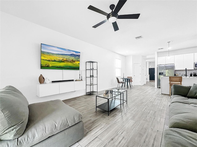 living room with ceiling fan