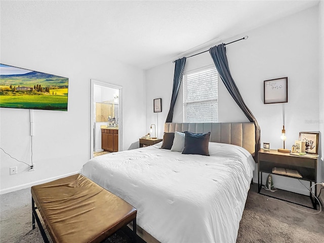 carpeted bedroom with ensuite bathroom