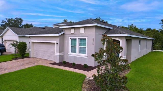 view of front of house with a front lawn and a garage