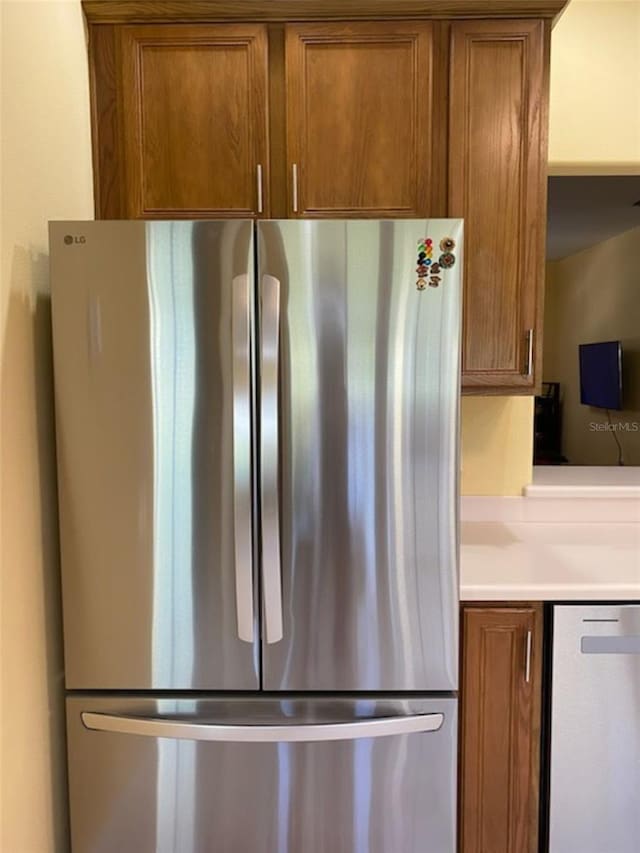 interior space featuring stainless steel fridge