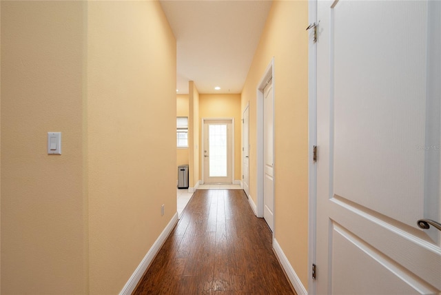 corridor with wood-type flooring