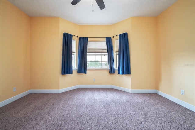 unfurnished room with ceiling fan and carpet floors