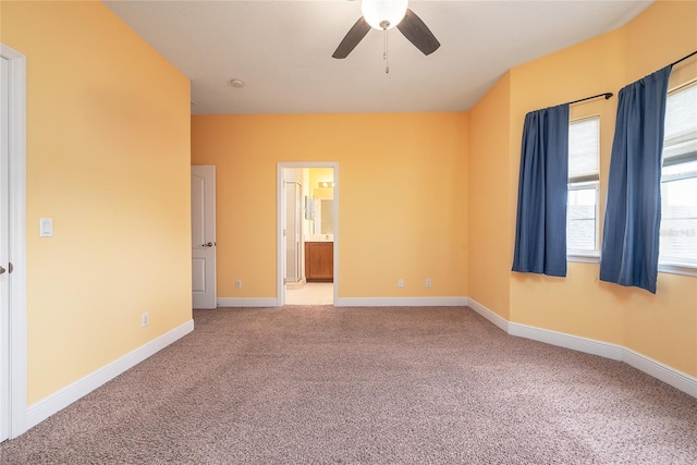 carpeted empty room with ceiling fan