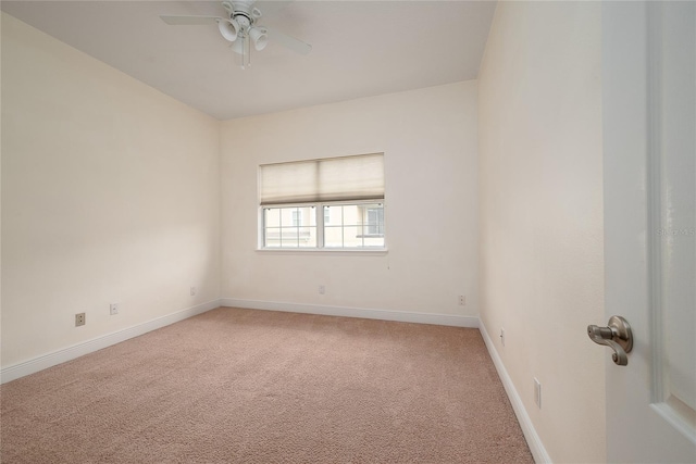 spare room with ceiling fan and carpet floors