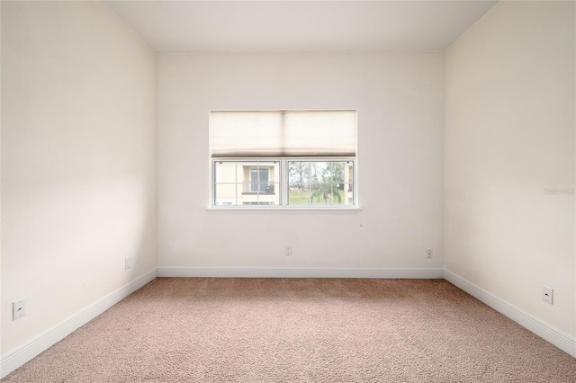 unfurnished room featuring carpet floors