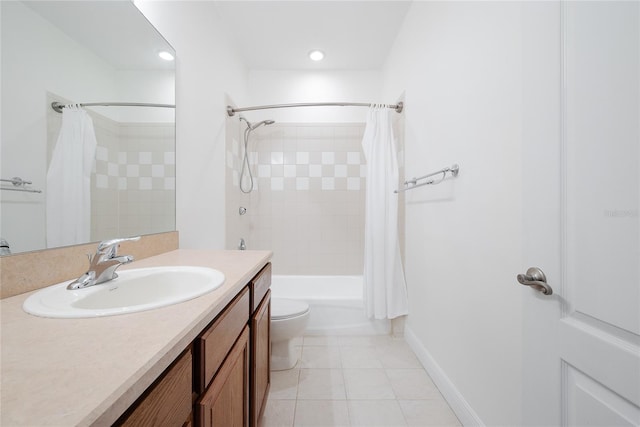 full bathroom featuring tile patterned flooring, shower / bath combination with curtain, vanity, and toilet