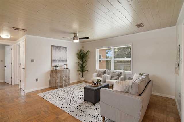 living room with ceiling fan, light parquet flooring, ornamental molding, and wooden ceiling