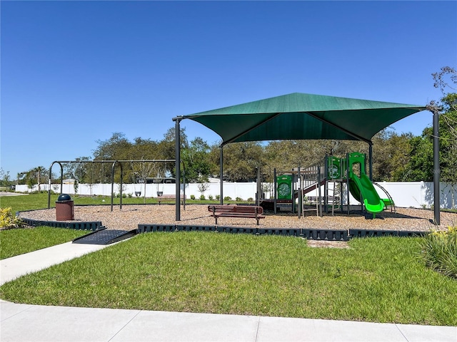 view of playground featuring a lawn