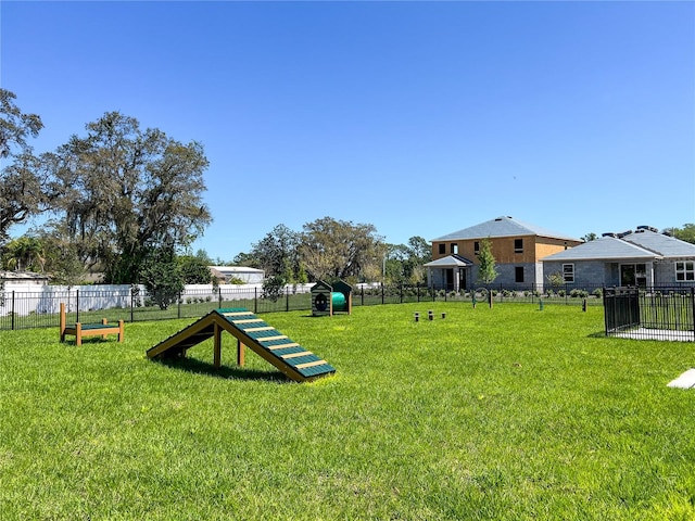 surrounding community with fence and a lawn