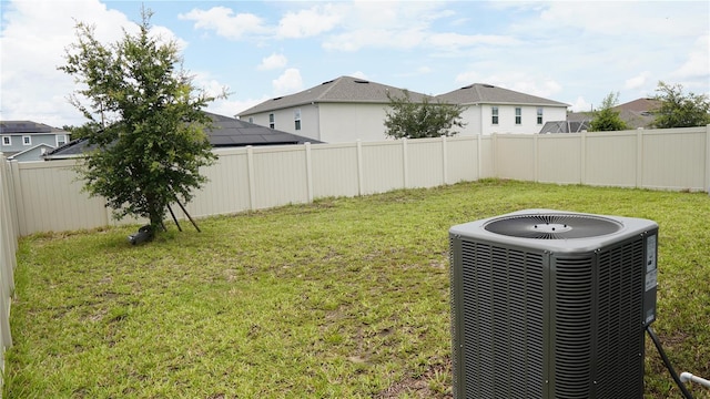 view of yard with central AC unit