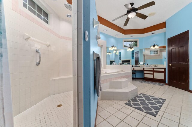 bathroom featuring ceiling fan, plus walk in shower, and vanity