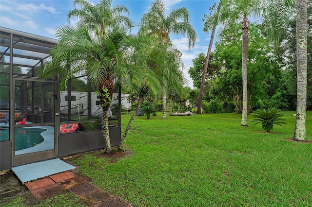 view of yard featuring a lanai