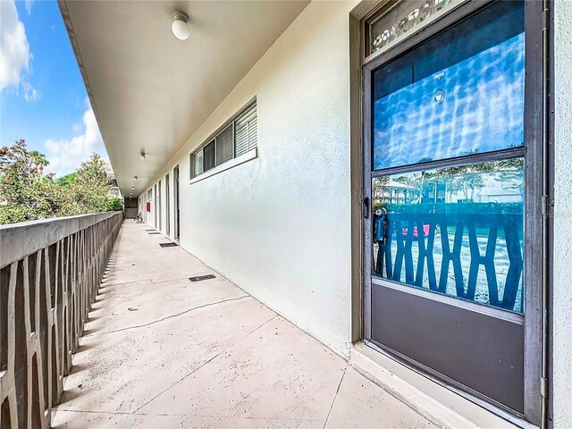 entrance to property with a balcony