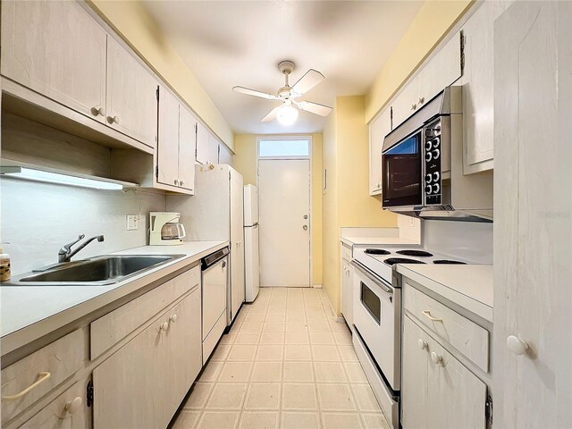 kitchen featuring tasteful backsplash, white cabinetry, sink, ceiling fan, and white appliances