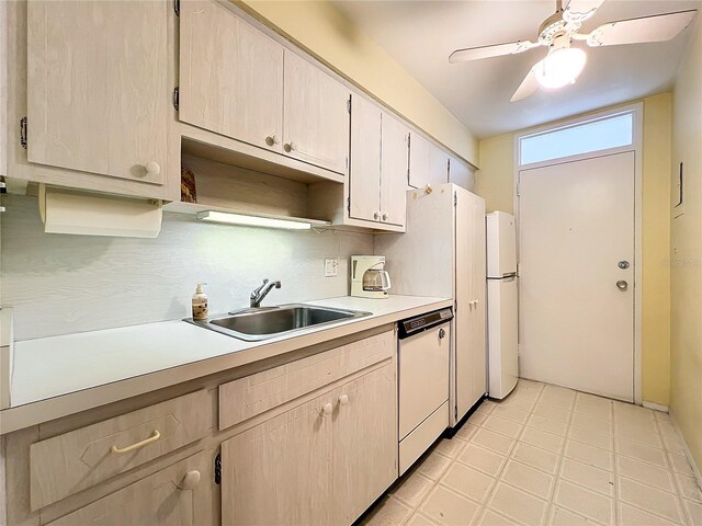 kitchen with ceiling fan, dishwasher, sink, and backsplash