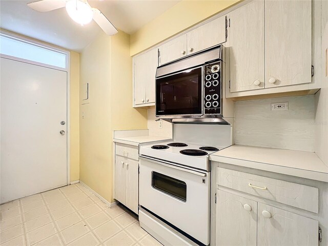 kitchen featuring white electric range oven and ceiling fan