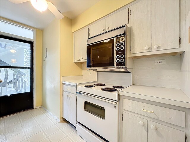 kitchen with white electric stove and ceiling fan