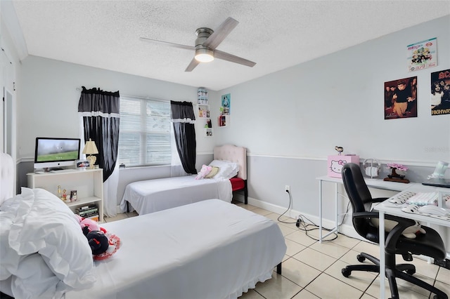 bedroom featuring light tile patterned flooring, a textured ceiling, and ceiling fan