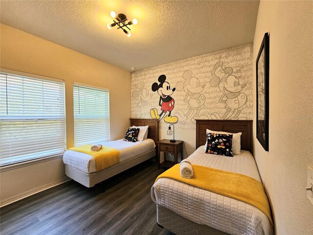 bedroom featuring hardwood / wood-style flooring and a textured ceiling