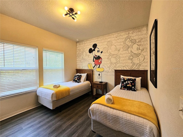 bedroom with dark wood-type flooring and a textured ceiling