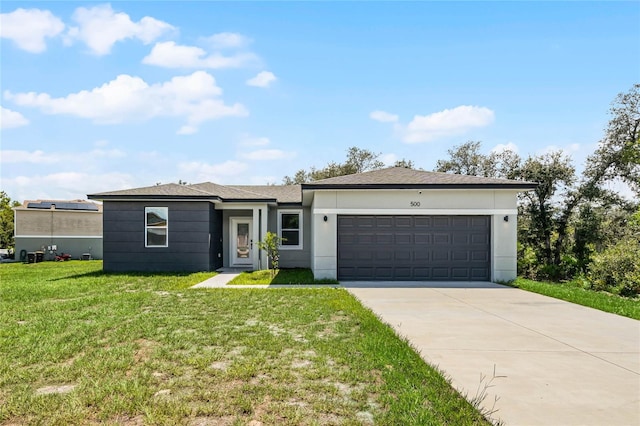 ranch-style home with a garage and a front yard