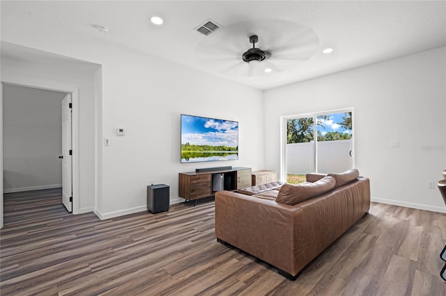 living room with hardwood / wood-style flooring and ceiling fan