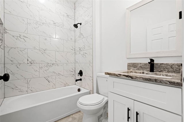 full bathroom featuring toilet, tiled shower / bath combo, and vanity