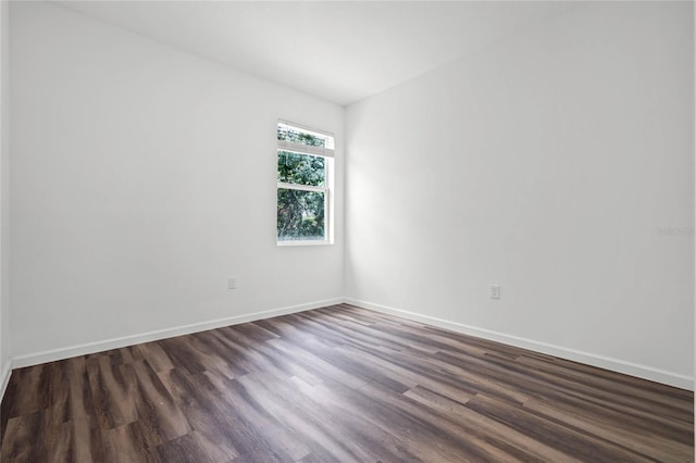 spare room with hardwood / wood-style flooring