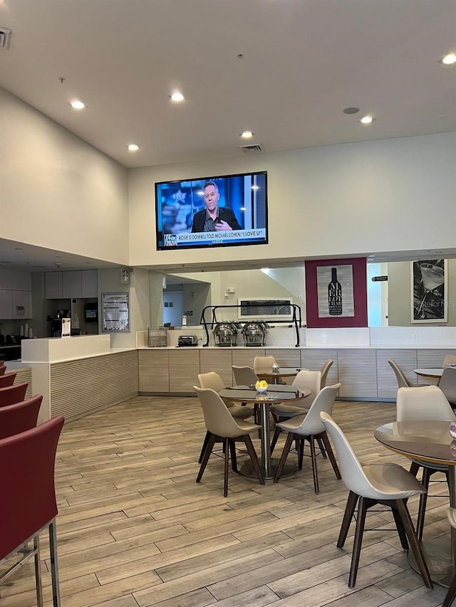 dining space with light hardwood / wood-style flooring