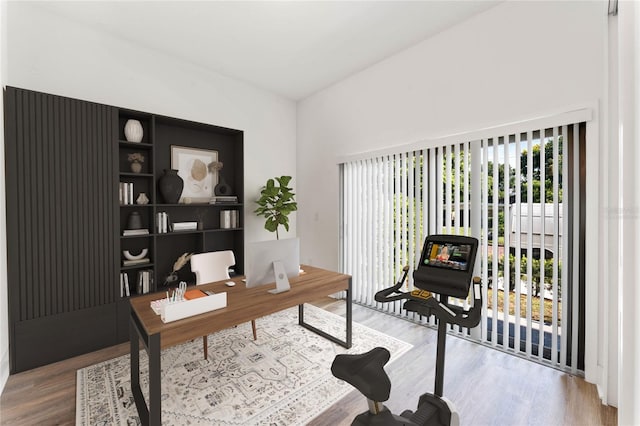 home office with hardwood / wood-style floors