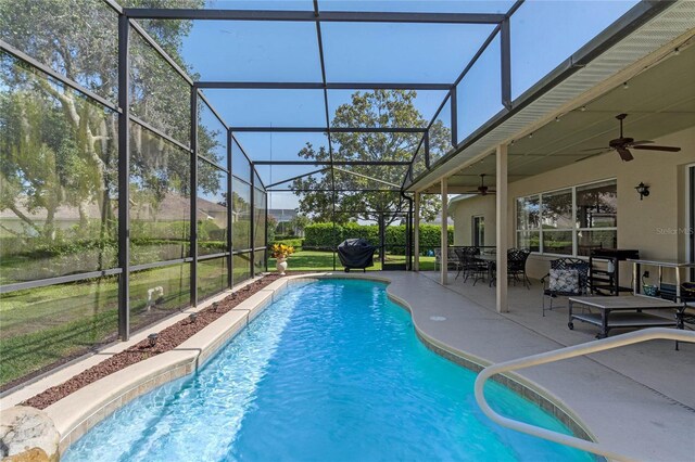 404 Hightower Dr, Debary, FL 32713 - swimming pool featuring a ceiling fan, a patio area, and glass enclosure