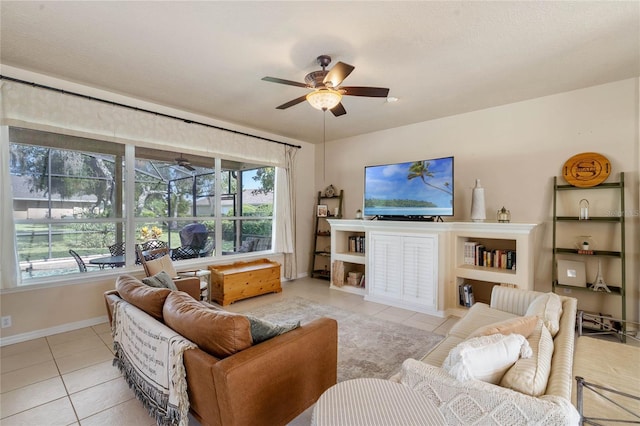 404 Hightower Dr, Debary, FL 32713 - living room featuring ceiling fan, tile patterned flooring, and baseboards