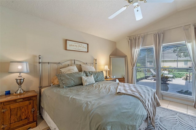 404 Hightower Dr, Debary, FL 32713 - bedroom with vaulted ceiling, light tile patterned floors, a textured ceiling, and a ceiling fan
