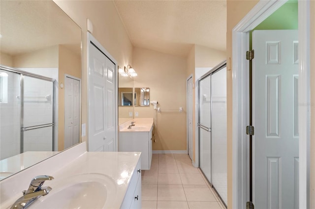 404 Hightower Dr, Debary, FL 32713 - full bathroom featuring a stall shower, tile patterned floors, two vanities, baseboards, and a textured ceiling