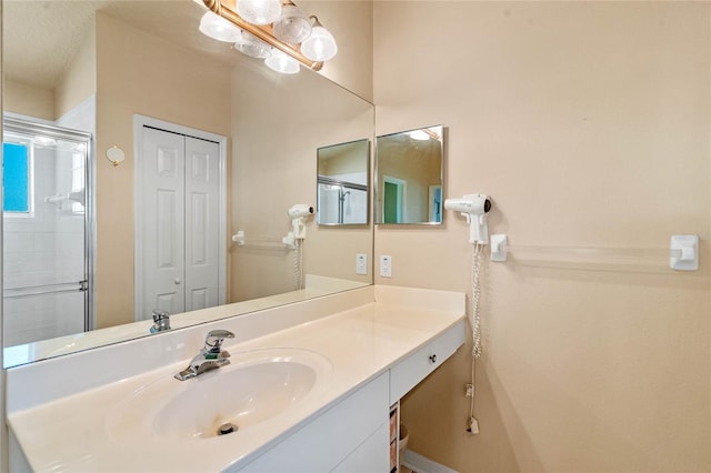 404 Hightower Dr, Debary, FL 32713 - bathroom featuring vanity, a closet, and an enclosed shower
