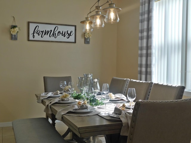 dining space featuring tile patterned floors